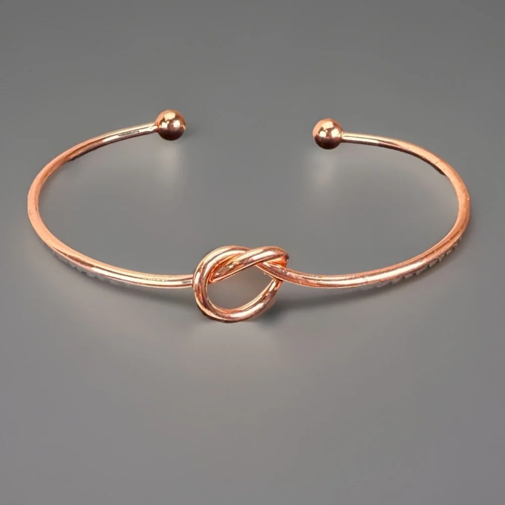 Pretty rose goldtone knotted minimalist cuff bracelet